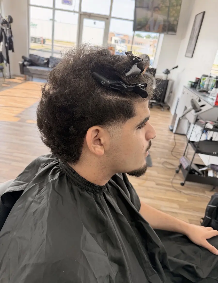Haircut in progress at the barber chair